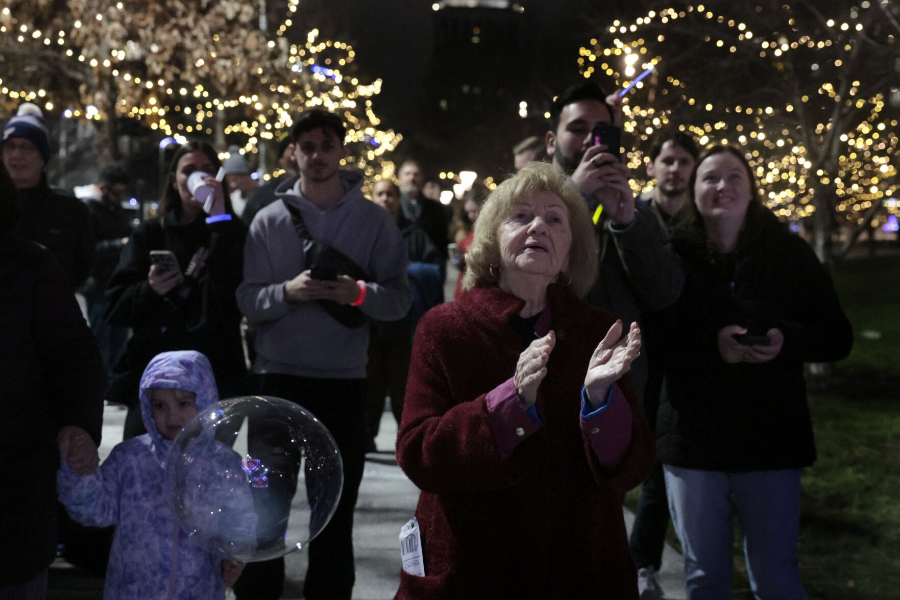 About two dozen people attend Night 6 of Chanukah Menorah Lighting